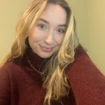 Armelle McGeachie a lady smiling at the camera in a red top