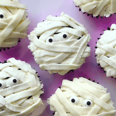 Spooky cupcakes - cupcakes with google eyes and icing which looks like bandages to represent a mummy