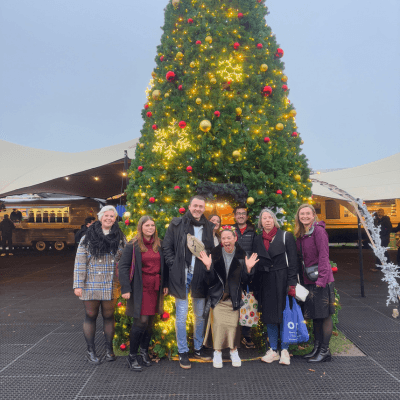 neurobox team stand in front of a christmas tree