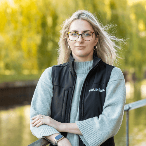 Eve Hasler, a blonde woman wearing glasses
