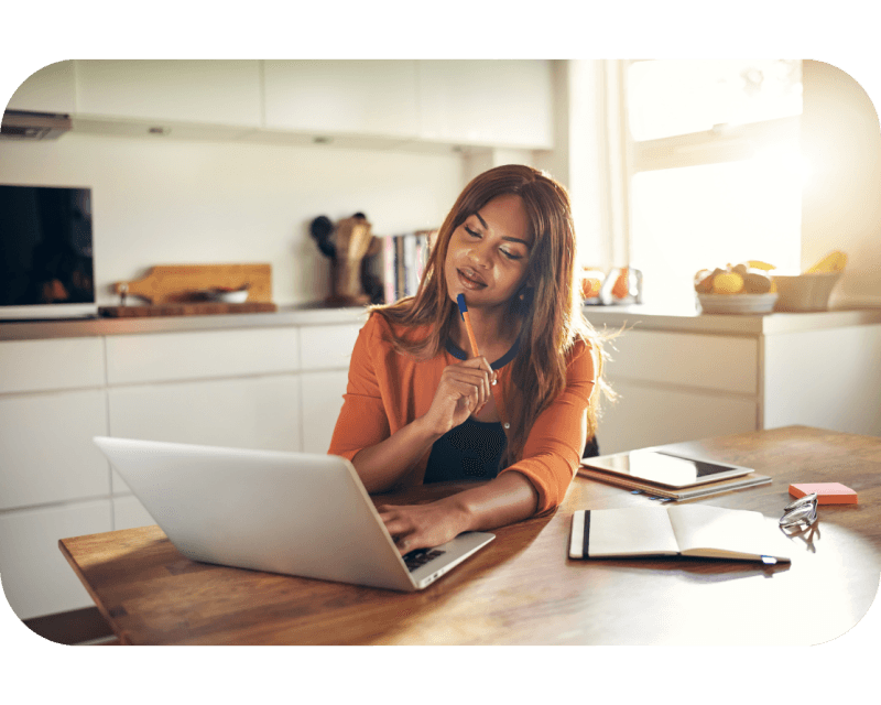 A Black Female, working remotely from the kitchen table